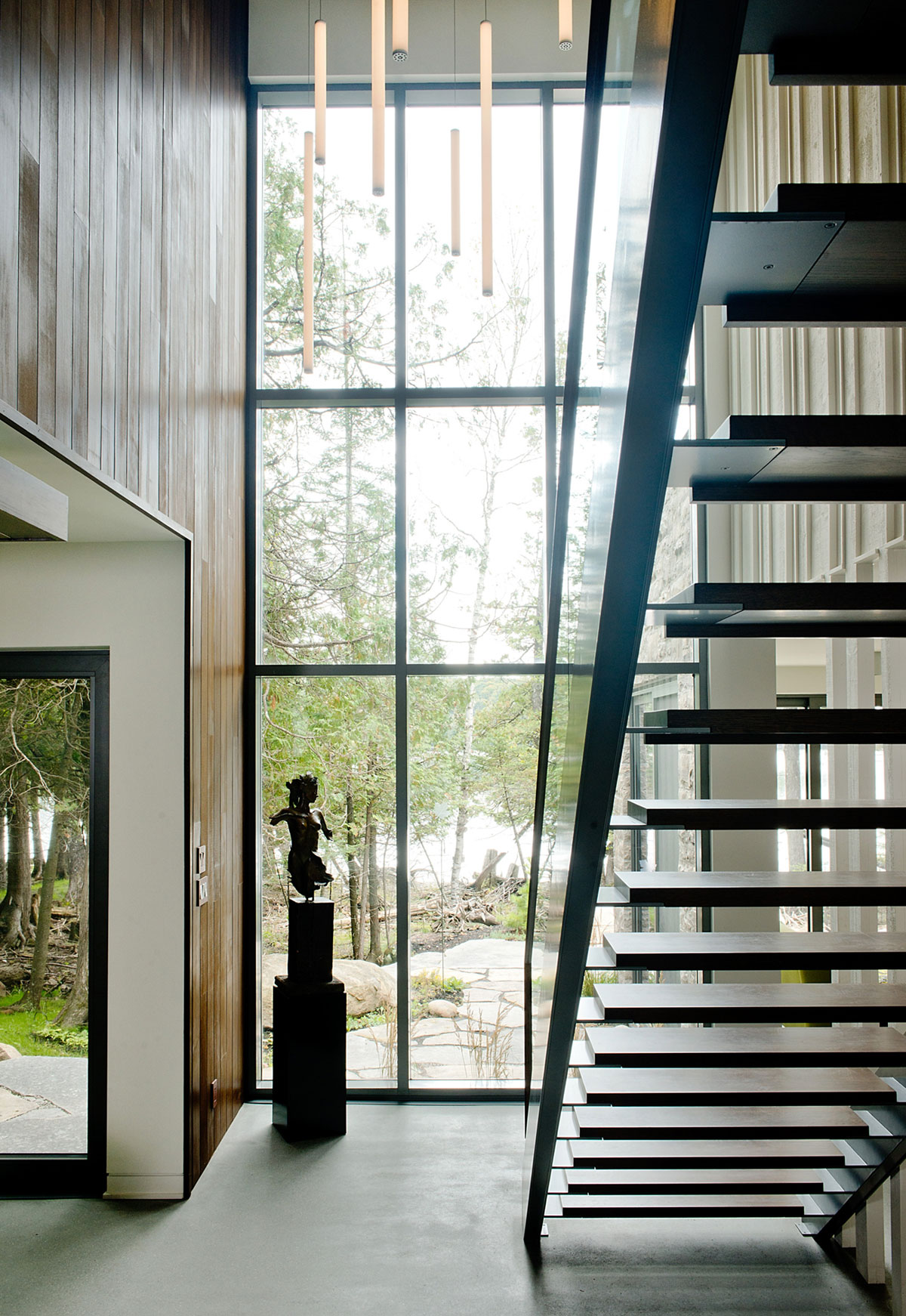 A Stunning Contemporary Home with Large Terrace Nestled in the Woods of Harrington, Quebec by Boom Town (27)