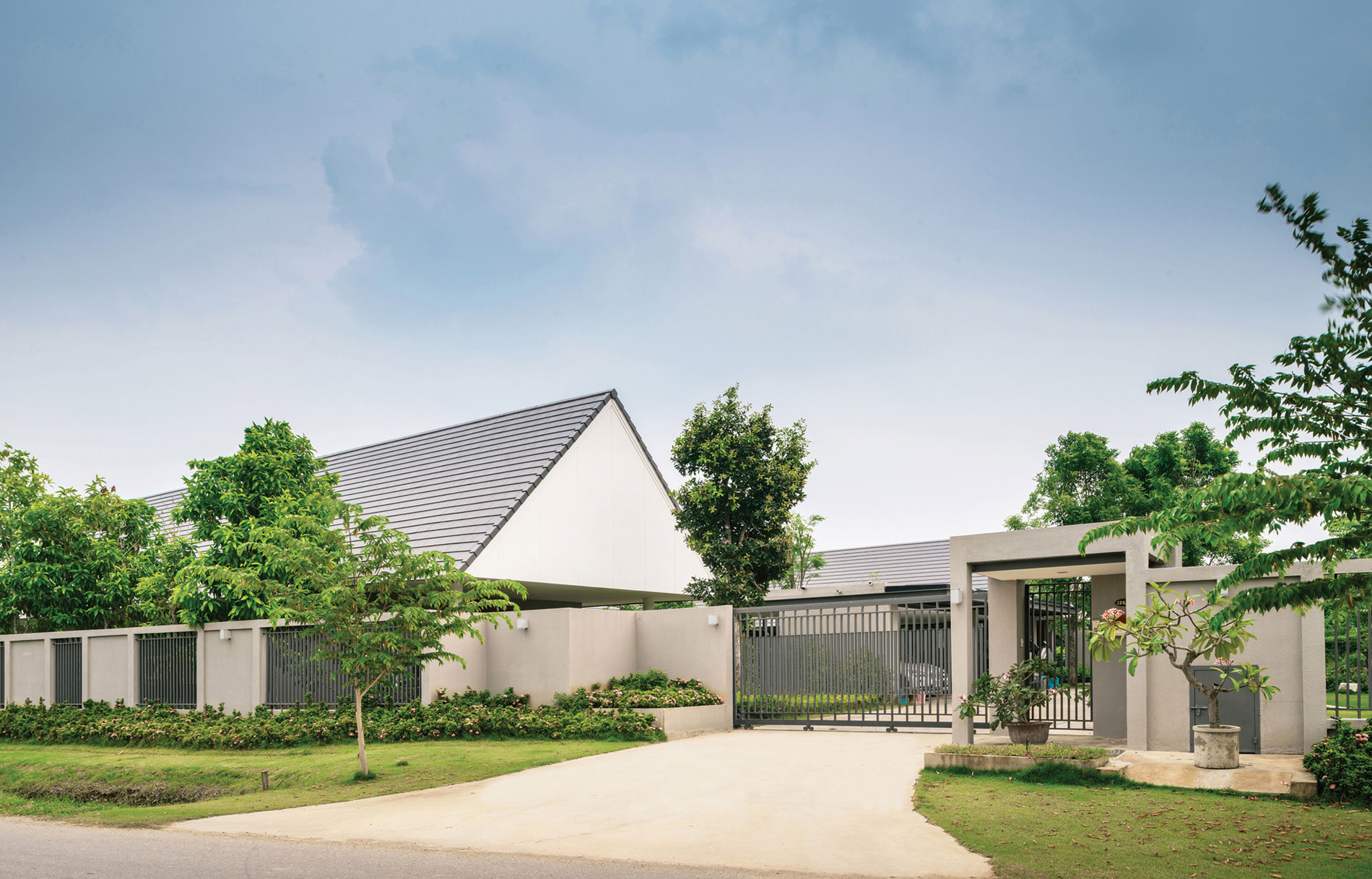 A Stunning Contemporary Triangle House with Gabled Walls in Nakhon Pathom, Thailand by Phongphat Ueasangkhomset (2)