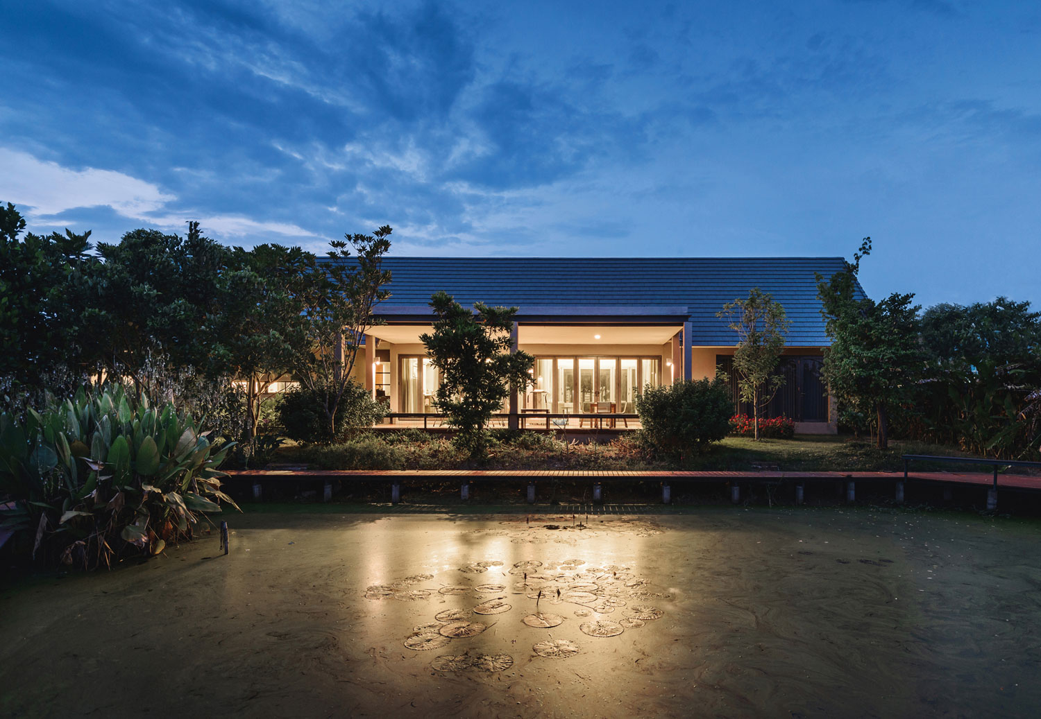 A Stunning Contemporary Triangle House with Gabled Walls in Nakhon Pathom, Thailand by Phongphat Ueasangkhomset (21)