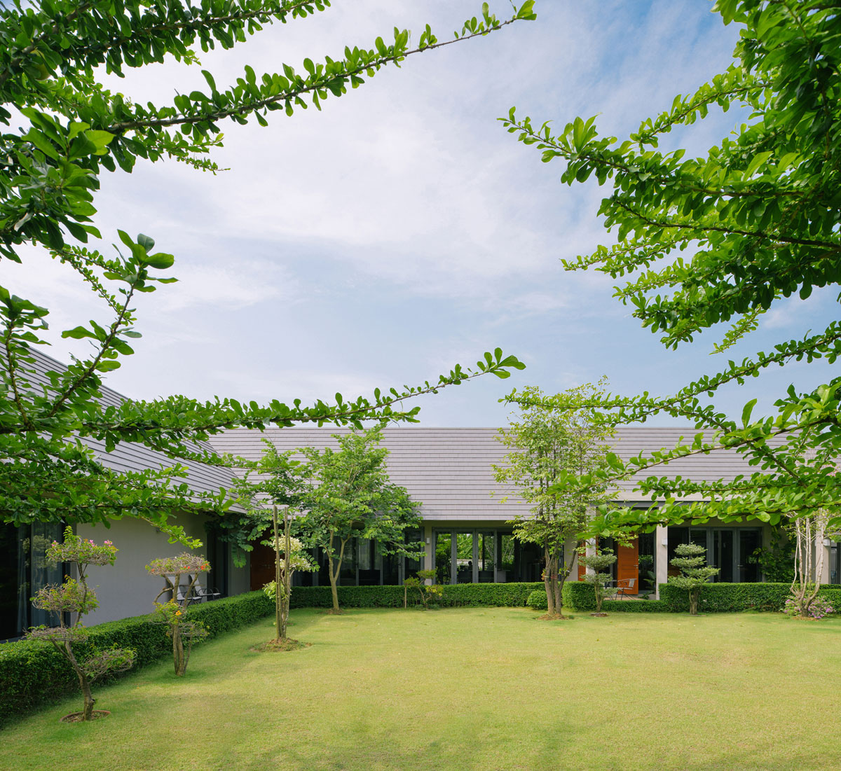 A Stunning Contemporary Triangle House with Gabled Walls in Nakhon Pathom, Thailand by Phongphat Ueasangkhomset (5)