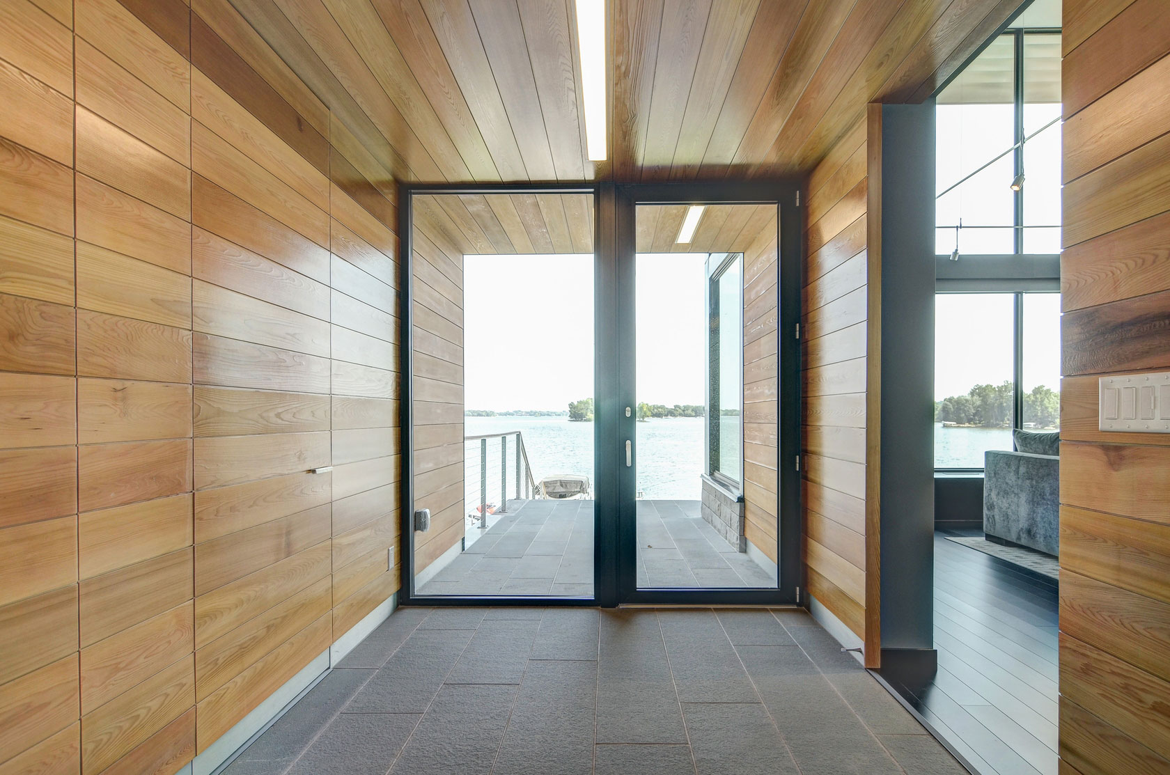 A Stunning Glass Lake House with Modern Silhouette of Earthy Materials in Minnesota by Rosenow | Peterson Design (19)