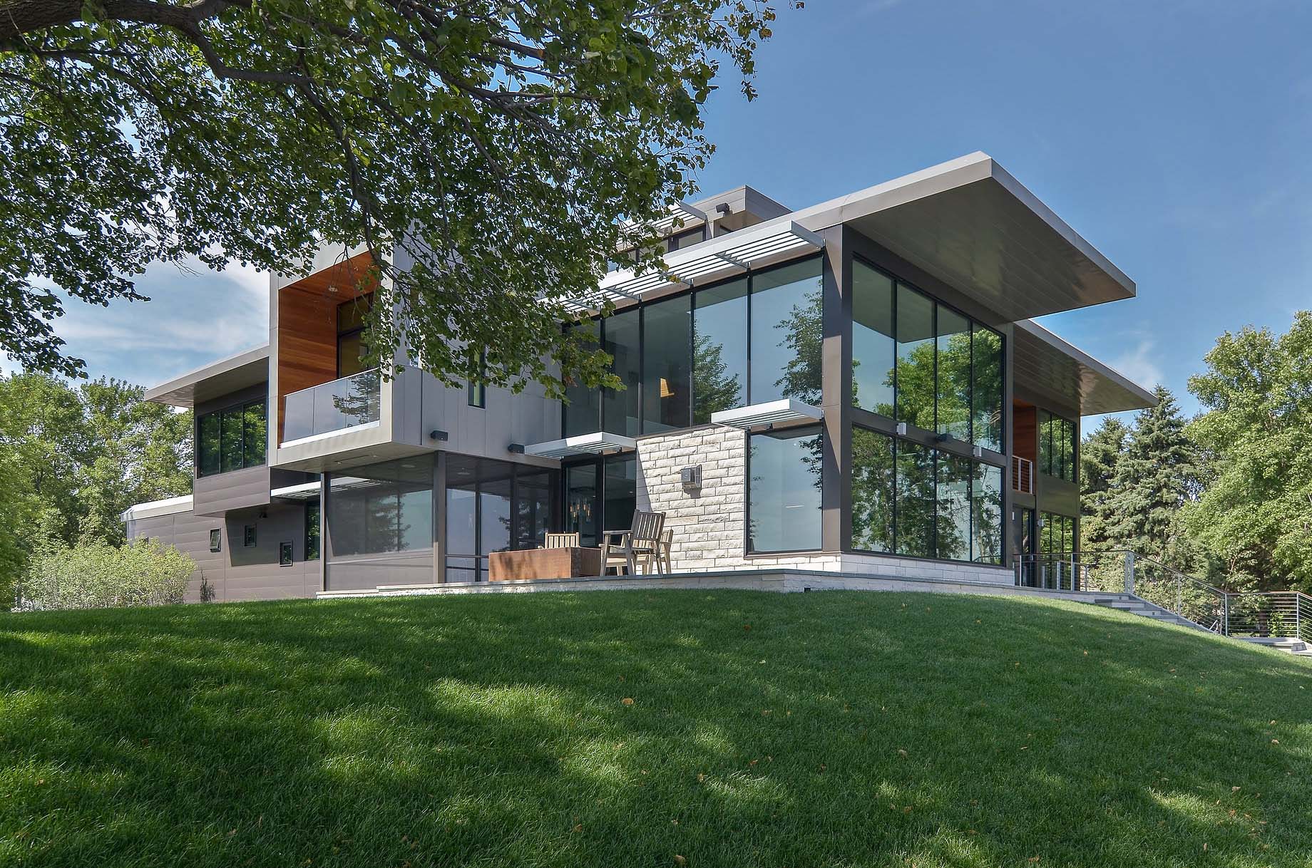 A Stunning Glass Lake House with Modern Silhouette of Earthy Materials in Minnesota by Rosenow | Peterson Design (2)
