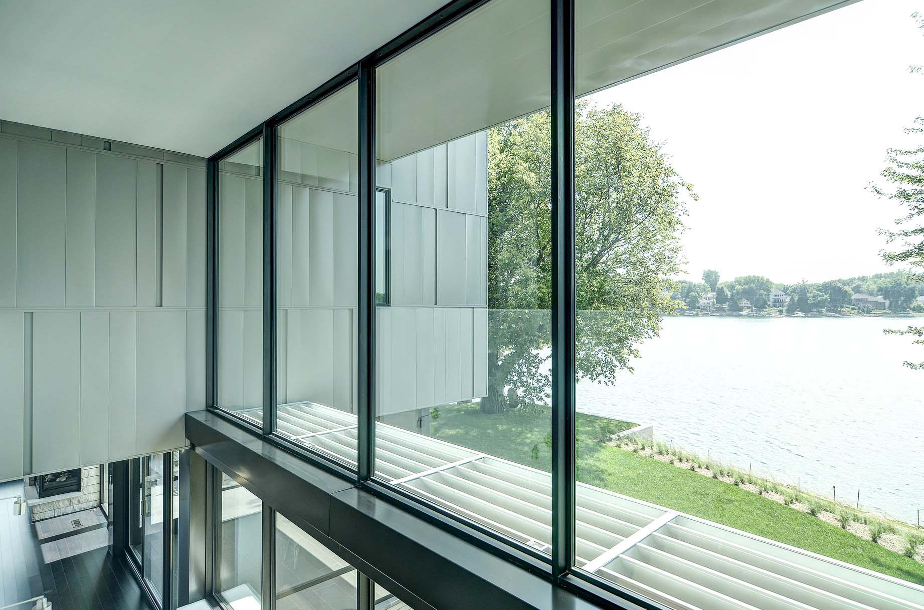 A Stunning Glass Lake House with Modern Silhouette of Earthy Materials in Minnesota by Rosenow | Peterson Design (36)