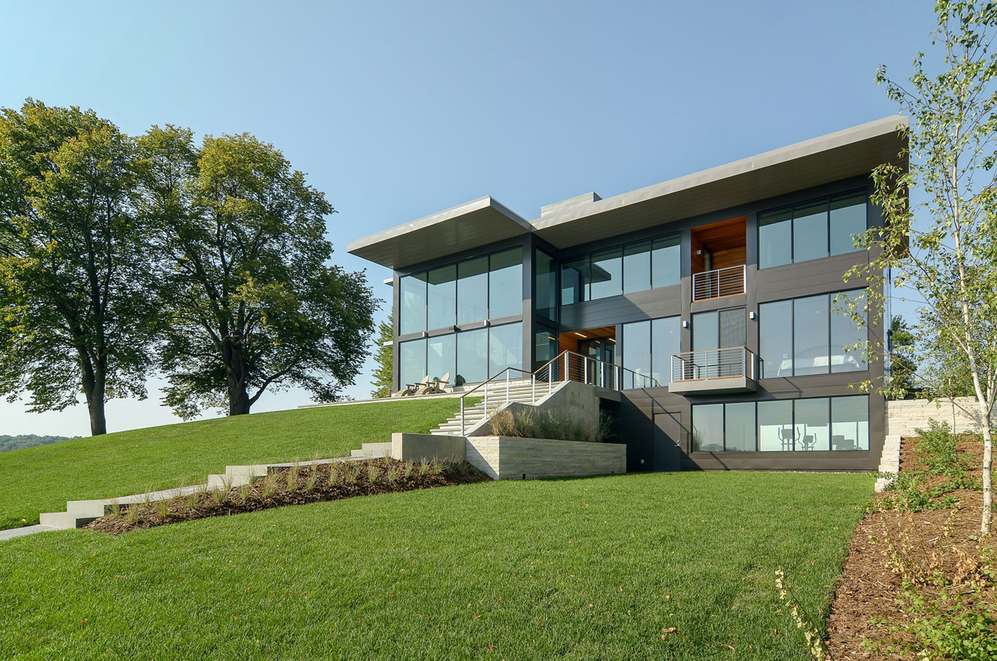 A Stunning Glass Lake House with Modern Silhouette of Earthy Materials in Minnesota by Rosenow | Peterson Design (4)