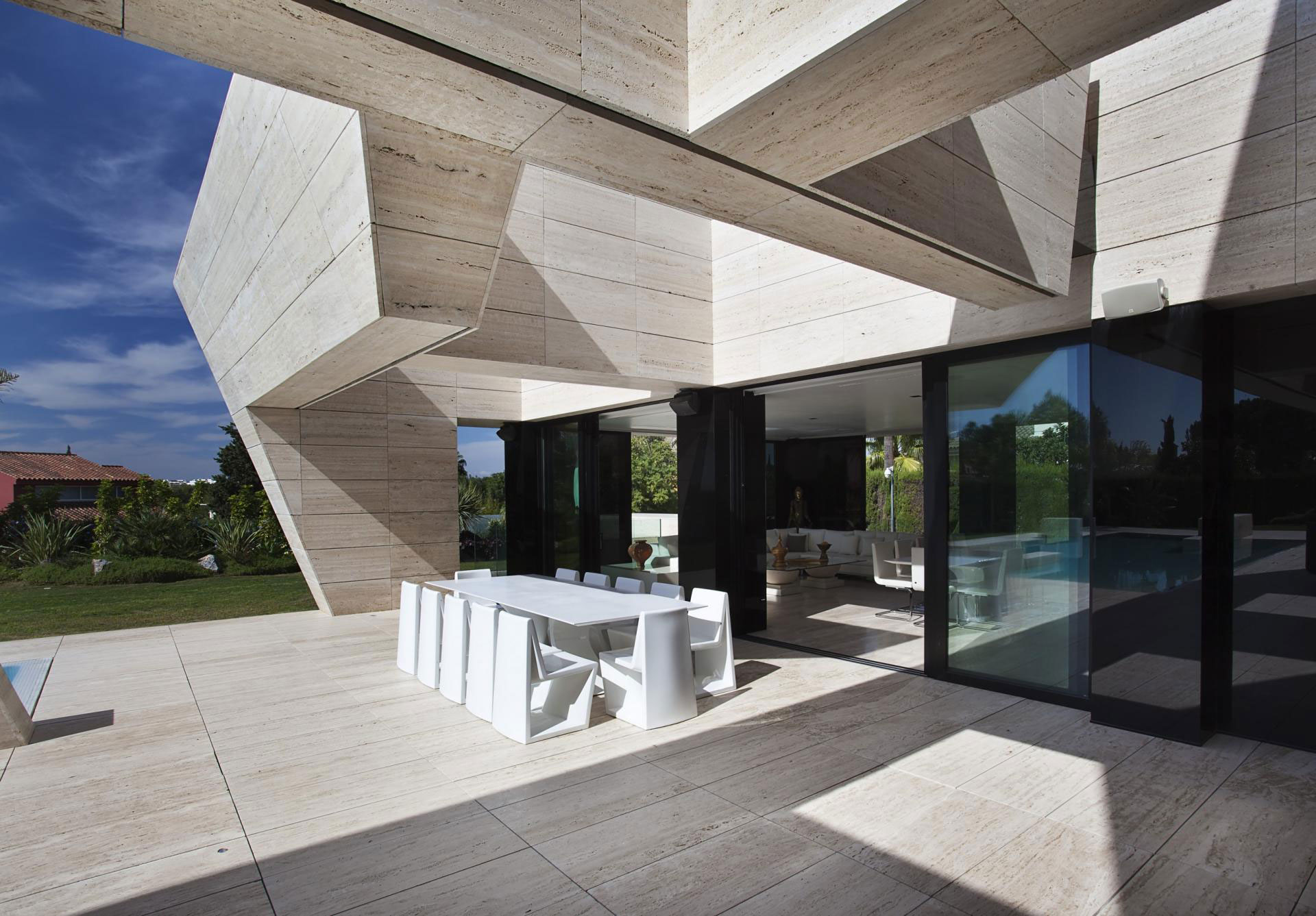 A Stylish Contemporary Concrete House with Black Glass and Marble Facade in Seville by A-cero (10)