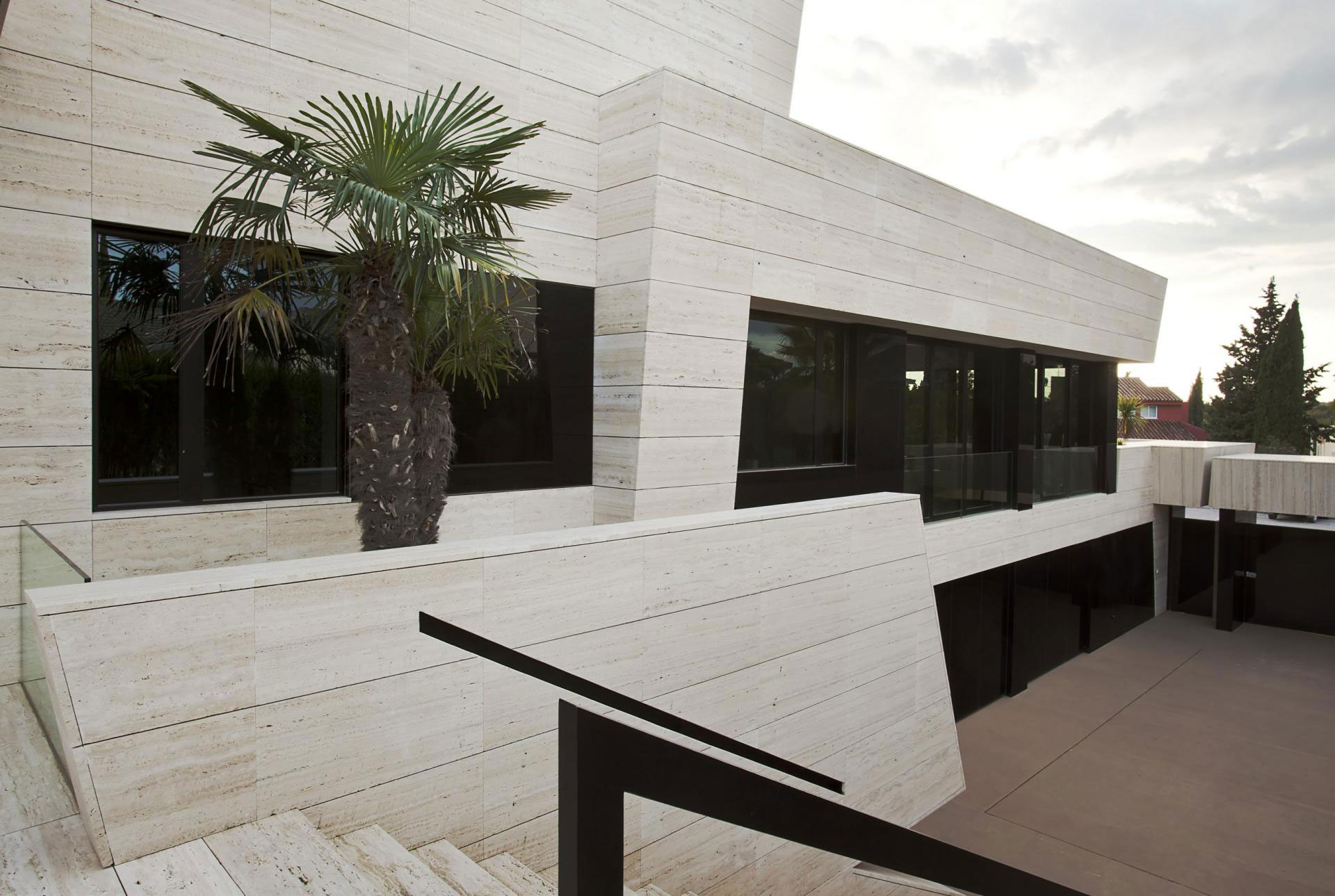 A Stylish Contemporary Concrete House with Black Glass and Marble Facade in Seville by A-cero (12)