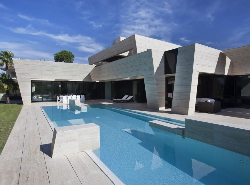 A Stylish Contemporary Concrete House with Black Glass and Marble Facade in Seville by A-cero (2)