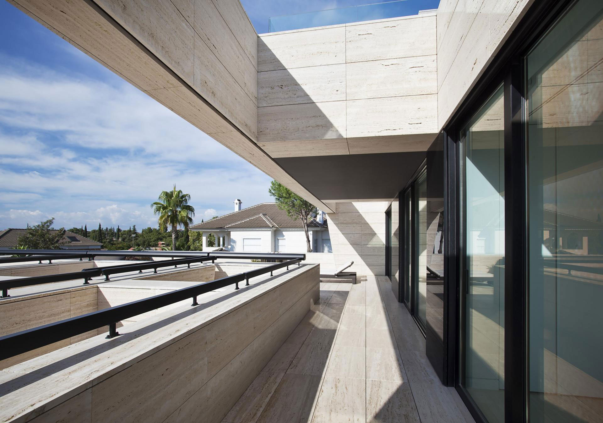 A Stylish Contemporary Concrete House with Black Glass and Marble Facade in Seville by A-cero (22)