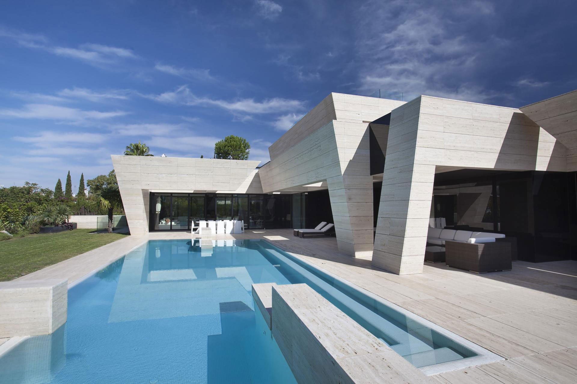 A Stylish Contemporary Concrete House with Black Glass and Marble Facade in Seville by A-cero (3)