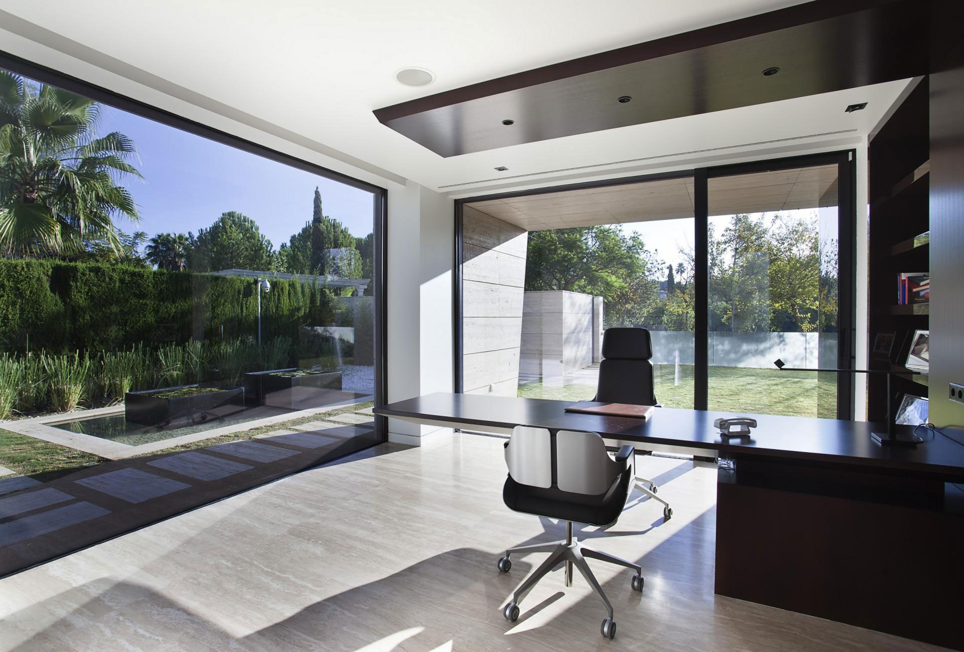 A Stylish Contemporary Concrete House with Black Glass and Marble Facade in Seville by A-cero (53)