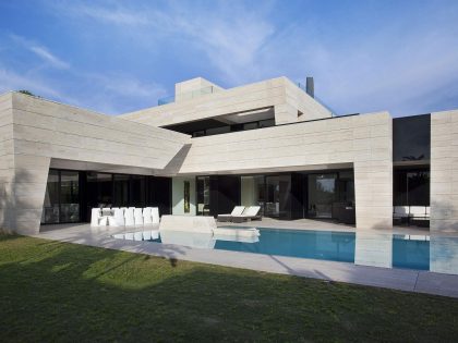 A Stylish Contemporary Concrete House with Black Glass and Marble Facade in Seville by A-cero (7)