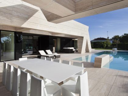 A Stylish Contemporary Concrete House with Black Glass and Marble Facade in Seville by A-cero (9)