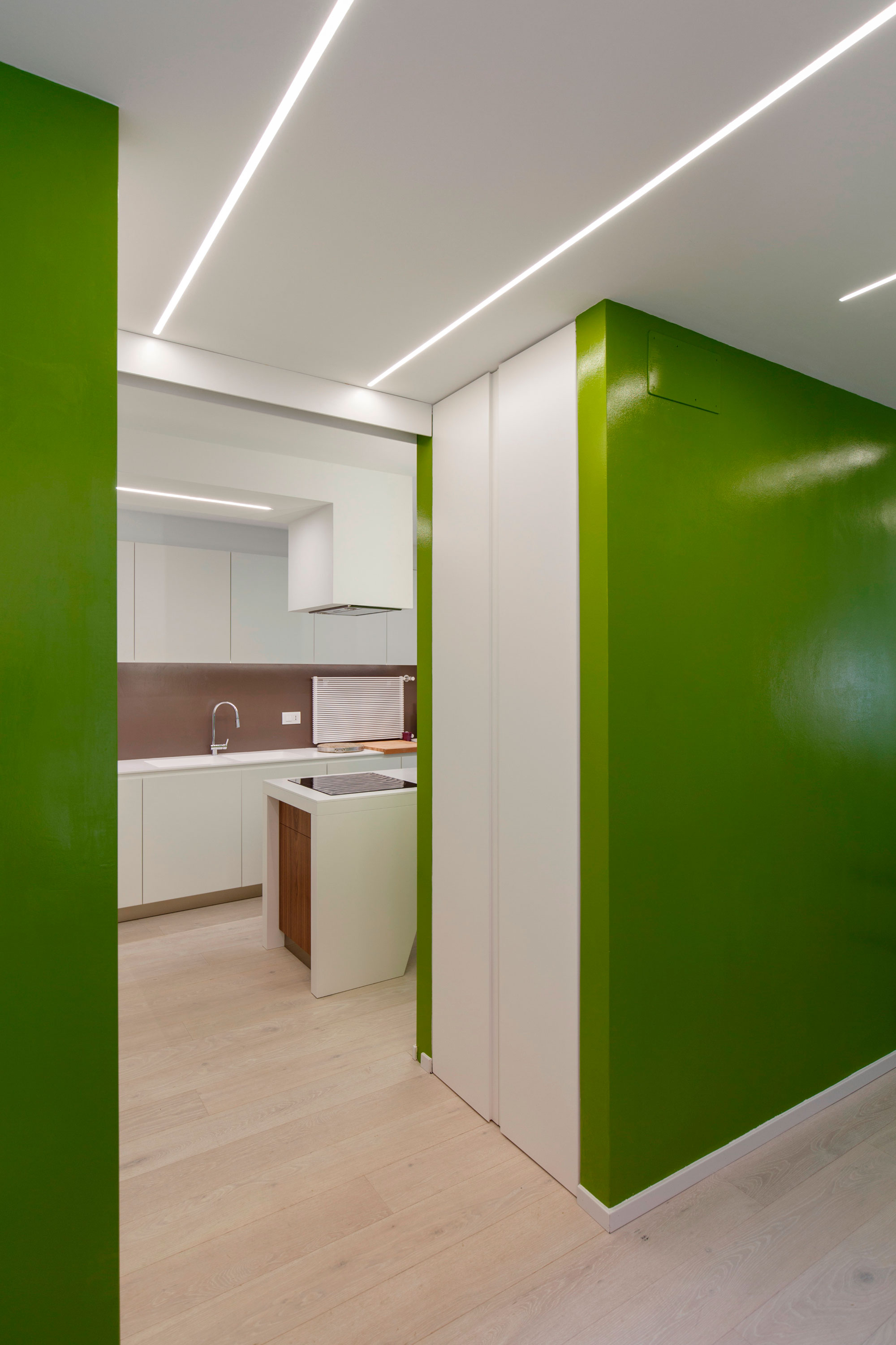 An Elegant Contemporary Attic Apartment with Green and White Interior in Bologna by MAMA (3)