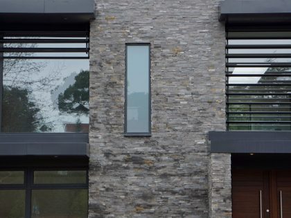 An Elegant Contemporary Home with Strong Contrast and Iroko Timber in Canford Cliffs by David James Architects (10)