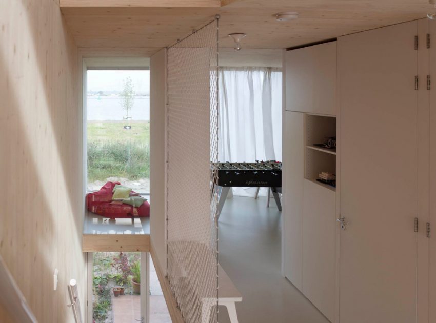 An Elegant Home with Wide Windows and Steel-Framed Balconies in Amsterdam by MEESVISSER (9)