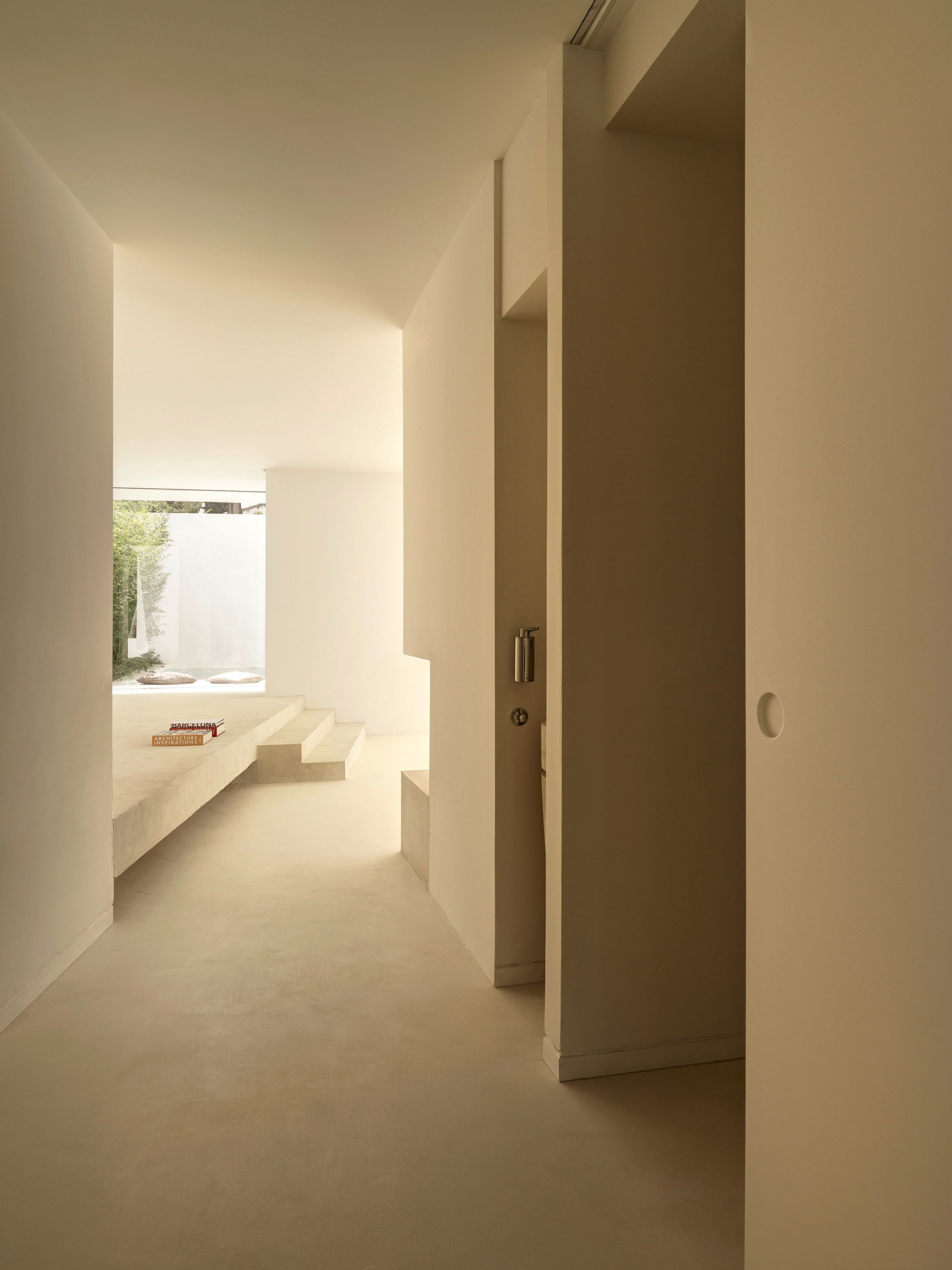 A Beautiful White Modern Home with an Internal Courtyard Surrounded by Perforated Walls in Marbella by Gus Wüstemann Architects (15)