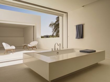 A Beautiful White Modern Home with an Internal Courtyard Surrounded by Perforated Walls in Marbella by Gus Wüstemann Architects (18)