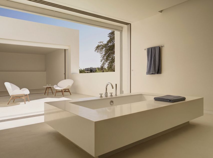 A Beautiful White Modern Home with an Internal Courtyard Surrounded by Perforated Walls in Marbella by Gus Wüstemann Architects (18)