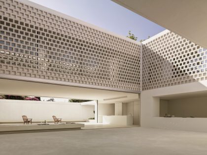 A Beautiful White Modern Home with an Internal Courtyard Surrounded by Perforated Walls in Marbella by Gus Wüstemann Architects (6)