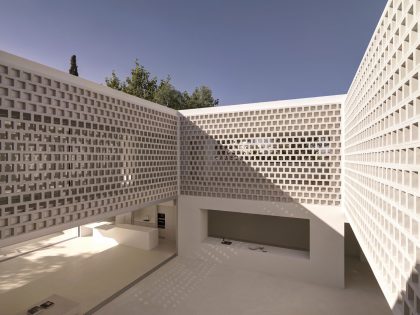 A Beautiful White Modern Home with an Internal Courtyard Surrounded by Perforated Walls in Marbella by Gus Wüstemann Architects (7)