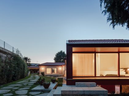 A Beautiful and Bright Red House Overlooks a Stunning Landscape in Vila Nova de Famalicão, Portugal by NOARQ (18)