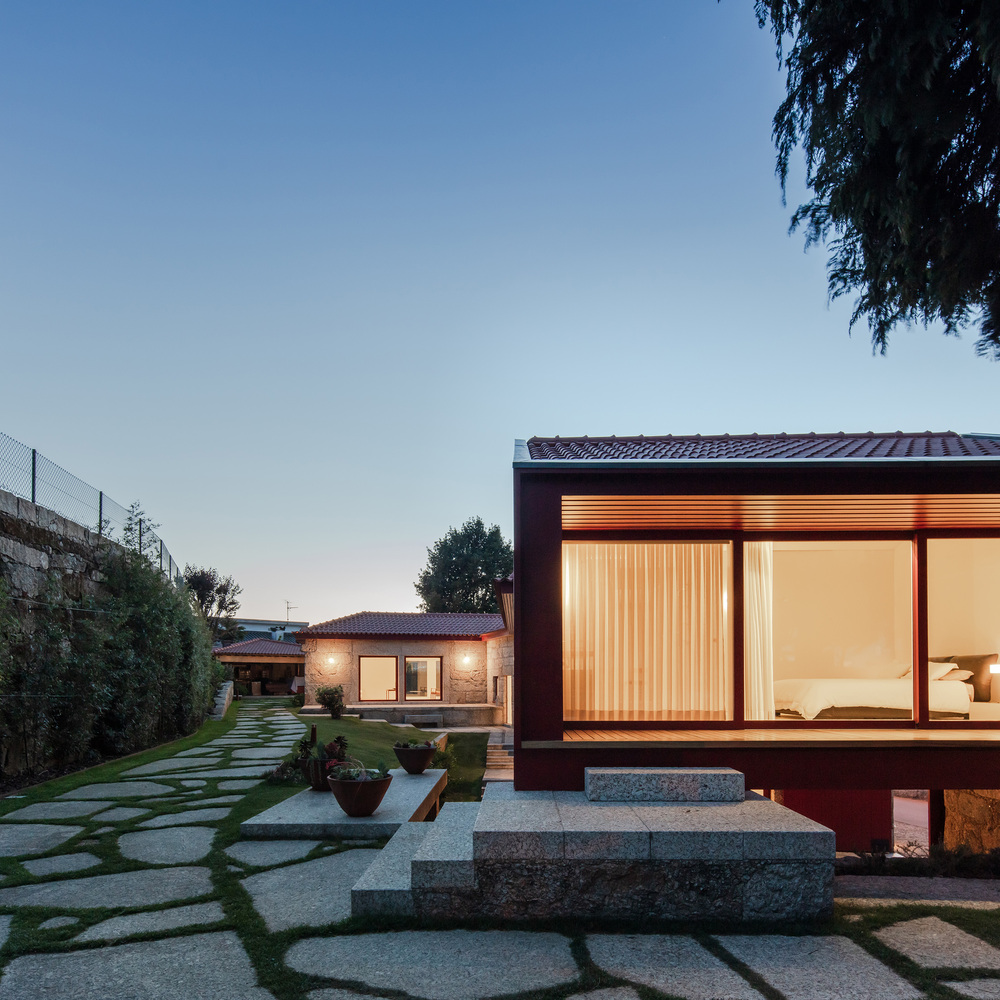 A Beautiful and Bright Red House Overlooks a Stunning Landscape in Vila Nova de Famalicão, Portugal by NOARQ (18)