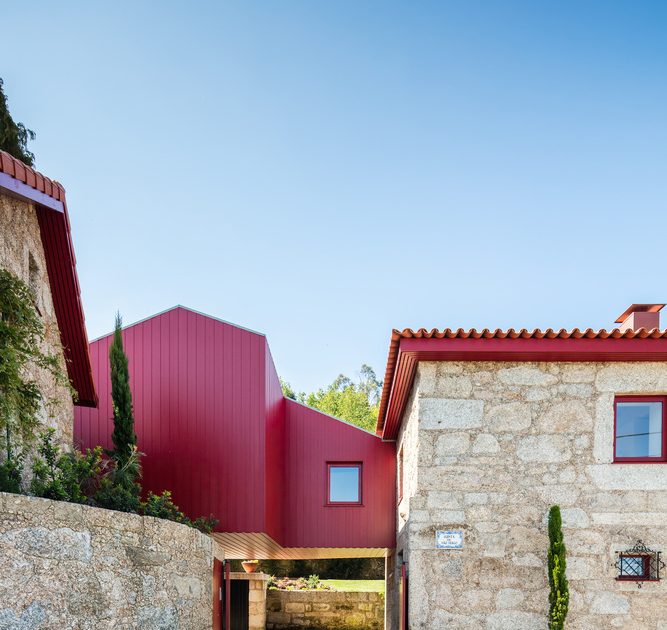 A Beautiful and Bright Red House Overlooks a Stunning Landscape in Vila Nova de Famalicão, Portugal by NOARQ (2)