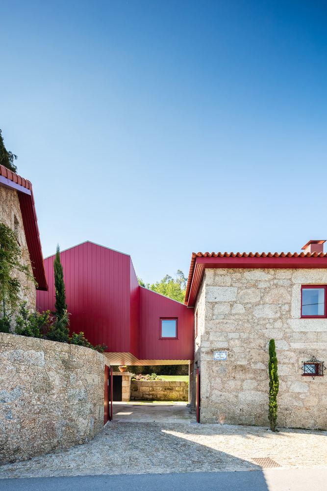 A Beautiful and Bright Red House Overlooks a Stunning Landscape in Vila Nova de Famalicão, Portugal by NOARQ (2)