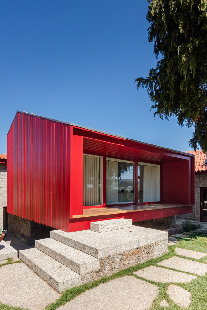 A Beautiful and Bright Red House Overlooks a Stunning Landscape in Vila Nova de Famalicão, Portugal by NOARQ (4)