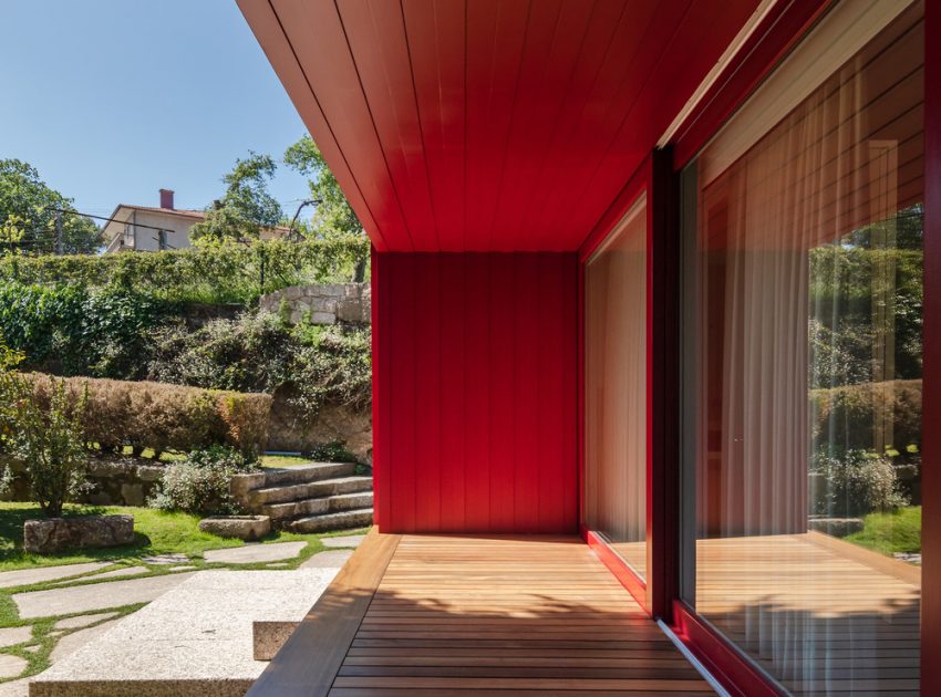 A Beautiful and Bright Red House Overlooks a Stunning Landscape in Vila Nova de Famalicão, Portugal by NOARQ (5)