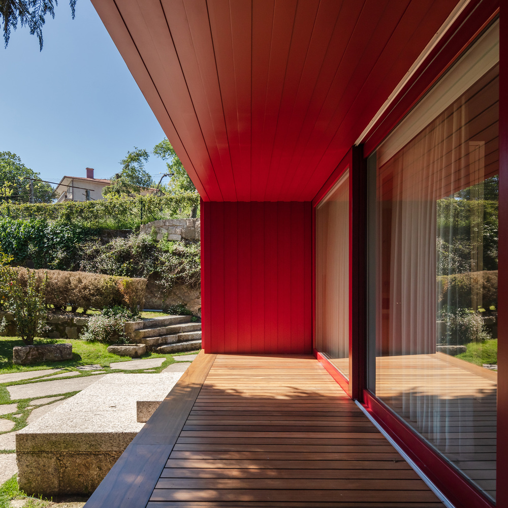 A Beautiful and Bright Red House Overlooks a Stunning Landscape in Vila Nova de Famalicão, Portugal by NOARQ (5)