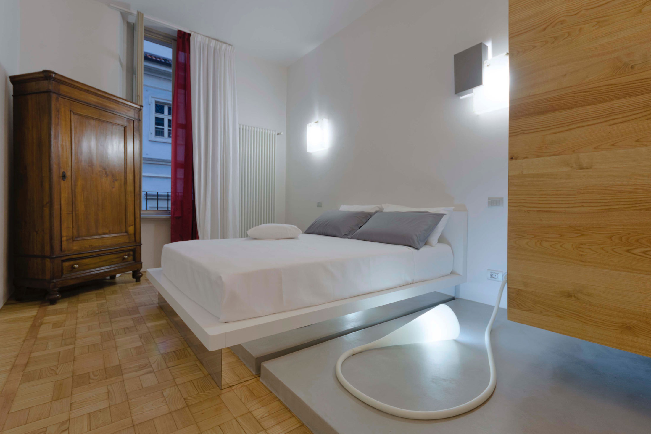 A Chic Contemporary Apartment with Red, Black and White Interiors in Turin, Italy by Archisbang (13)