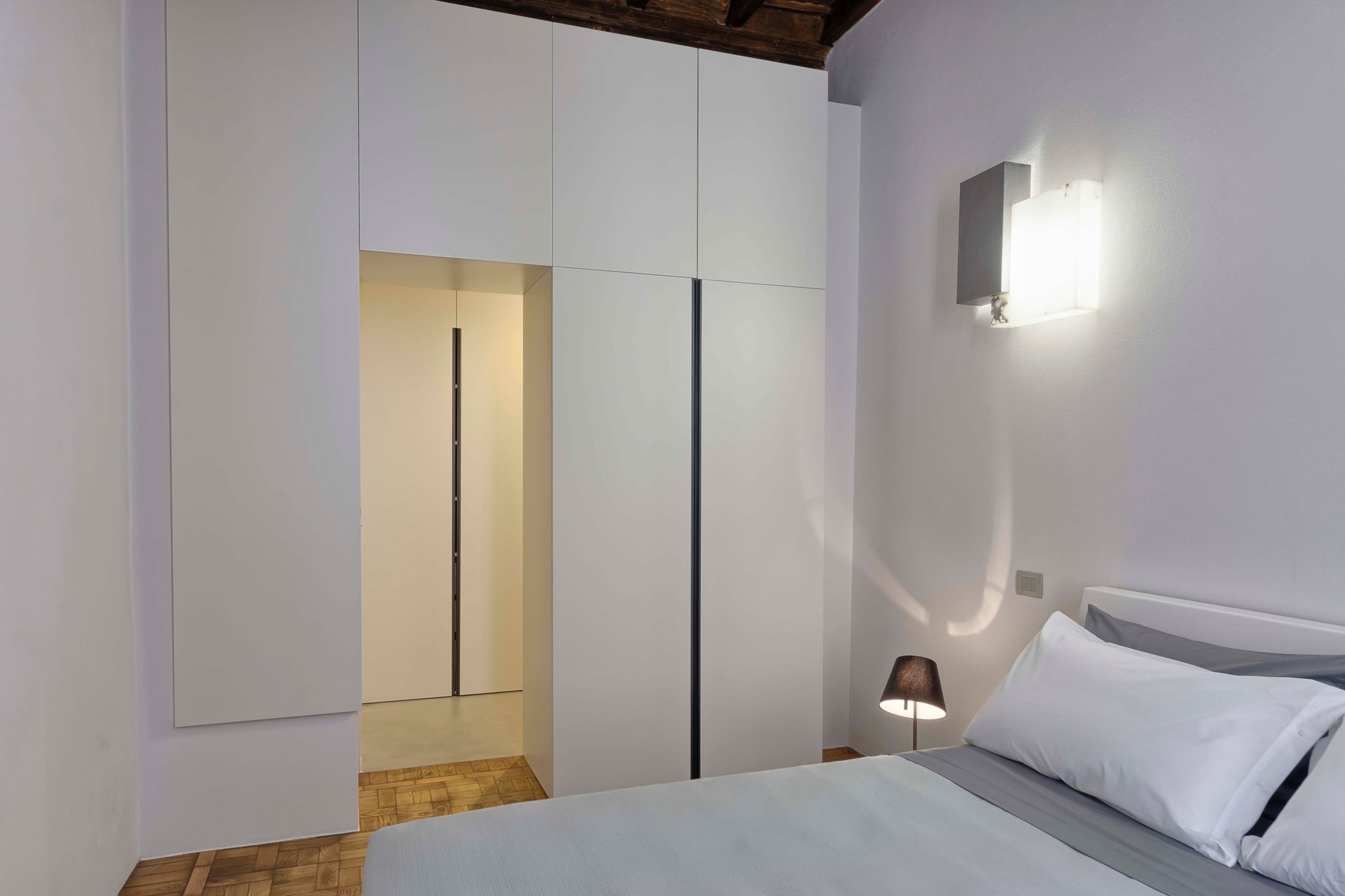 A Chic Contemporary Apartment with Red, Black and White Interiors in Turin, Italy by Archisbang (14)