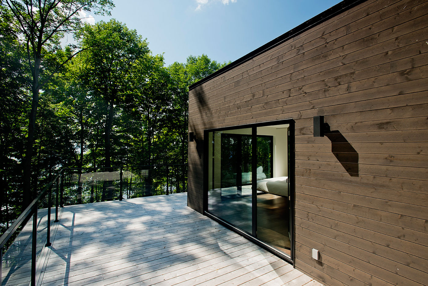 A Contemporary House with a Privileged Natural Environment of Lakes and Mountains in Quebec by Boom Town (15)