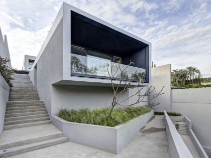 A Modern House Built From Dark Gray Steel, Glass, Wood, Concrete and Stone Materials in Mexico by Elías Rizo Arquitectos (1)