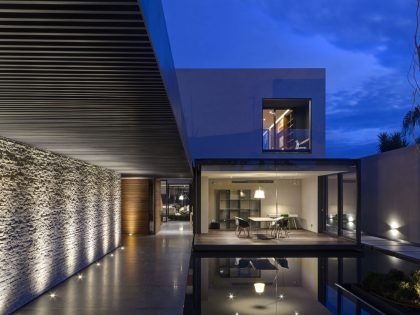 A Modern House Built From Dark Gray Steel, Glass, Wood, Concrete and Stone Materials in Mexico by Elías Rizo Arquitectos (11)