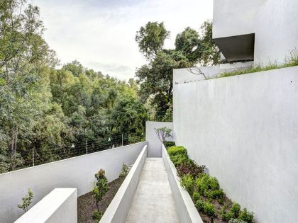 A Modern House Built From Dark Gray Steel, Glass, Wood, Concrete and Stone Materials in Mexico by Elías Rizo Arquitectos (2)