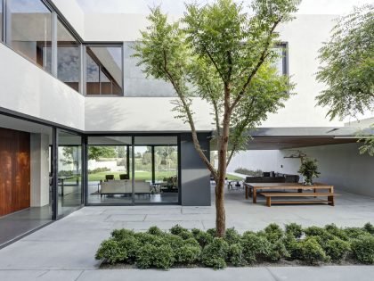 A Modern House Built From Dark Gray Steel, Glass, Wood, Concrete and Stone Materials in Mexico by Elías Rizo Arquitectos (5)