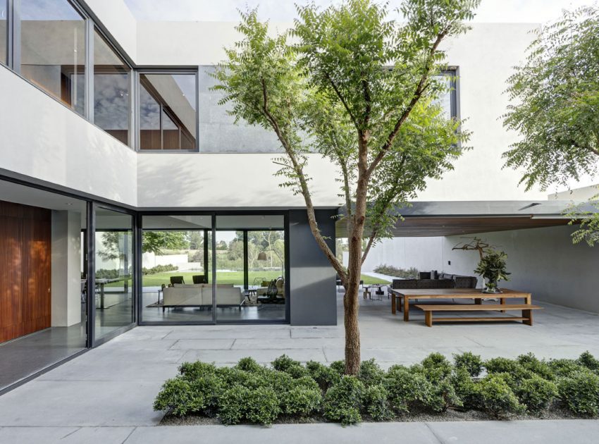 A Modern House Built From Dark Gray Steel, Glass, Wood, Concrete and Stone Materials in Mexico by Elías Rizo Arquitectos (5)