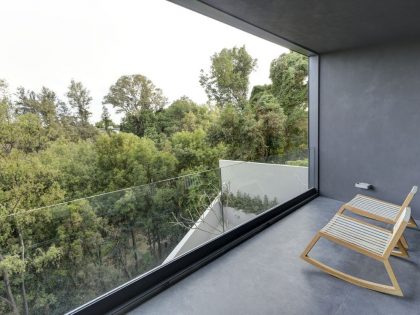 A Modern House Built From Dark Gray Steel, Glass, Wood, Concrete and Stone Materials in Mexico by Elías Rizo Arquitectos (7)
