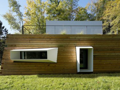 A Modern and Sculptural House on the Banks of Lake Massachusetts by Taylor and Miller Architecture (7)