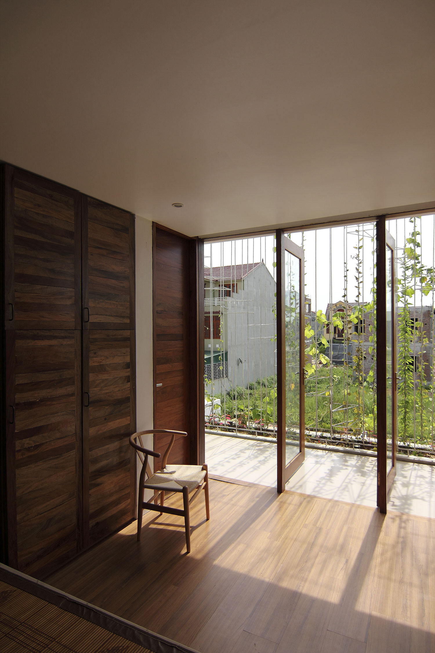 A Simple Country House with Natural Light and Wooden Furniture in Nghe An by Wangstudio (34)