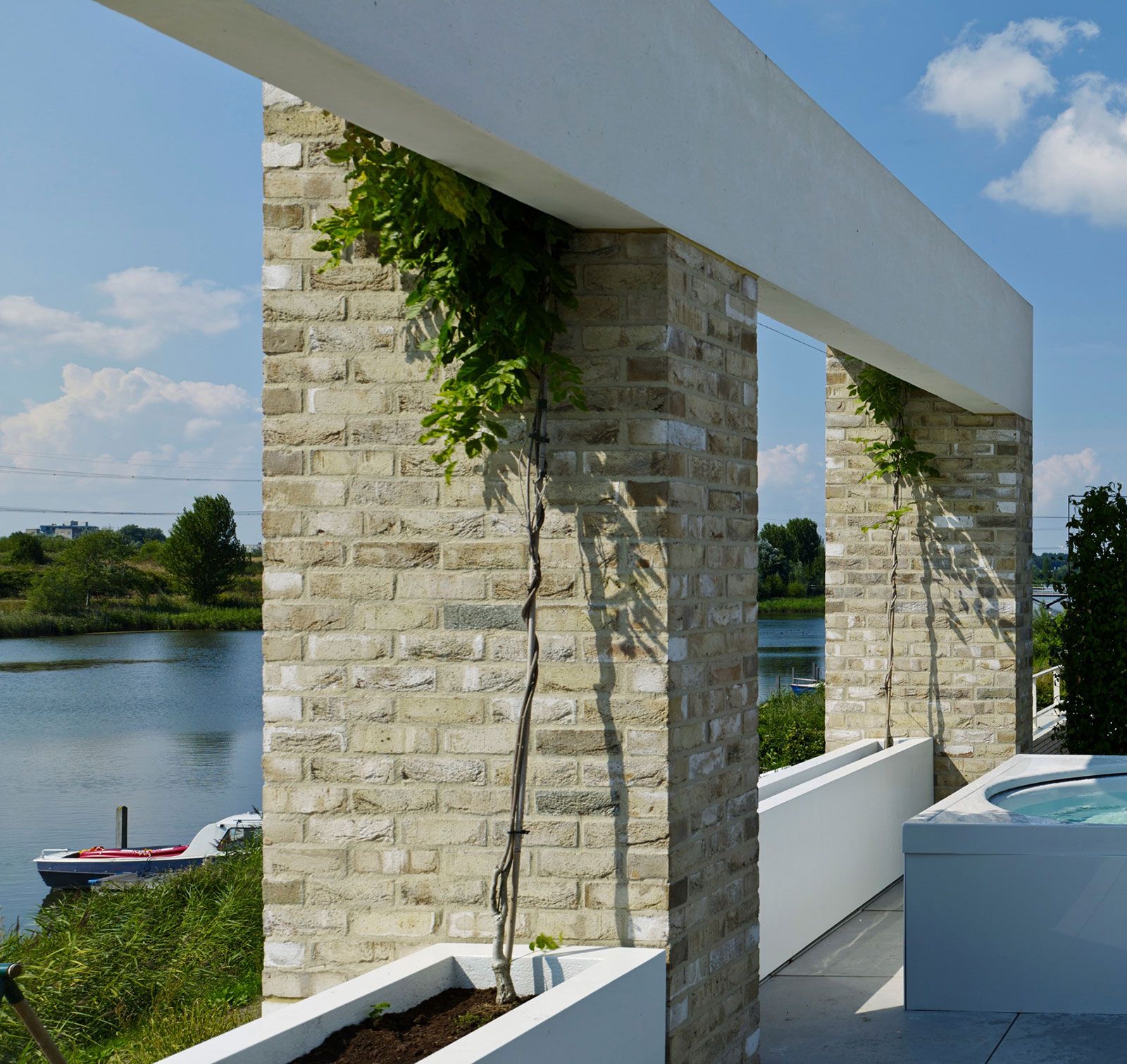 A Simple, Peaceful and Stylish Home Offers Stunning Views of Rieteiland, The Netherlands by Office Winhov (2)