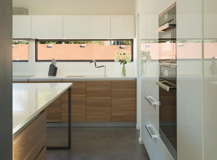 A Sleek and Bright Modern House Made of Concrete Forms, Metal and Glass in Seattle by Stephenson Design Collective (4)