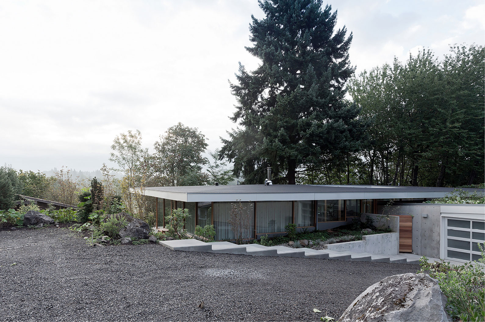 A Small Modern Hillside Home with Interior Courtyards and Gardens in Aurora by NO ARCHITECTURE (1)