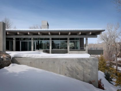 A Spectacular Concrete House Surrounded by Snow Filled Trees Mountain of USA