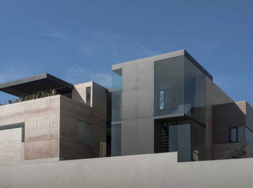 A Steel, Glass, Stone and Colored Concrete Home with Dramatic Central Staircase in Mexico City by Gantous Arquitectos (1)