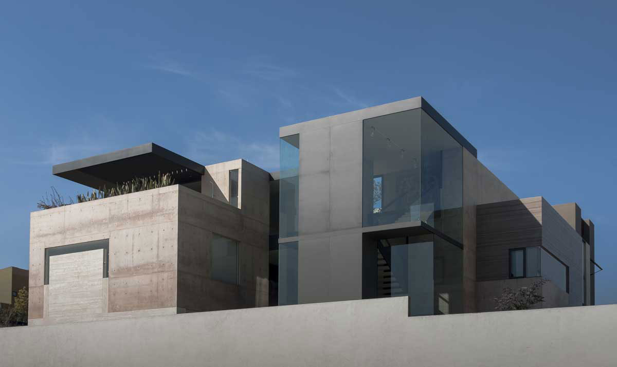 A Steel, Glass, Stone and Colored Concrete Home with Dramatic Central Staircase in Mexico City by Gantous Arquitectos (1)