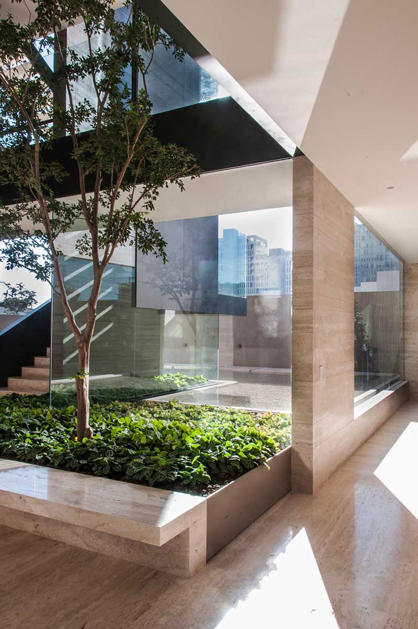 A Steel, Glass, Stone and Colored Concrete Home with Dramatic Central Staircase in Mexico City by Gantous Arquitectos (11)