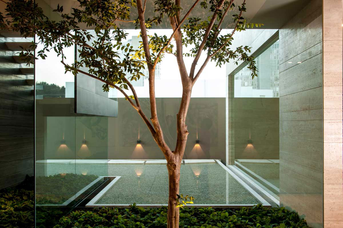 A Steel, Glass, Stone and Colored Concrete Home with Dramatic Central Staircase in Mexico City by Gantous Arquitectos (12)